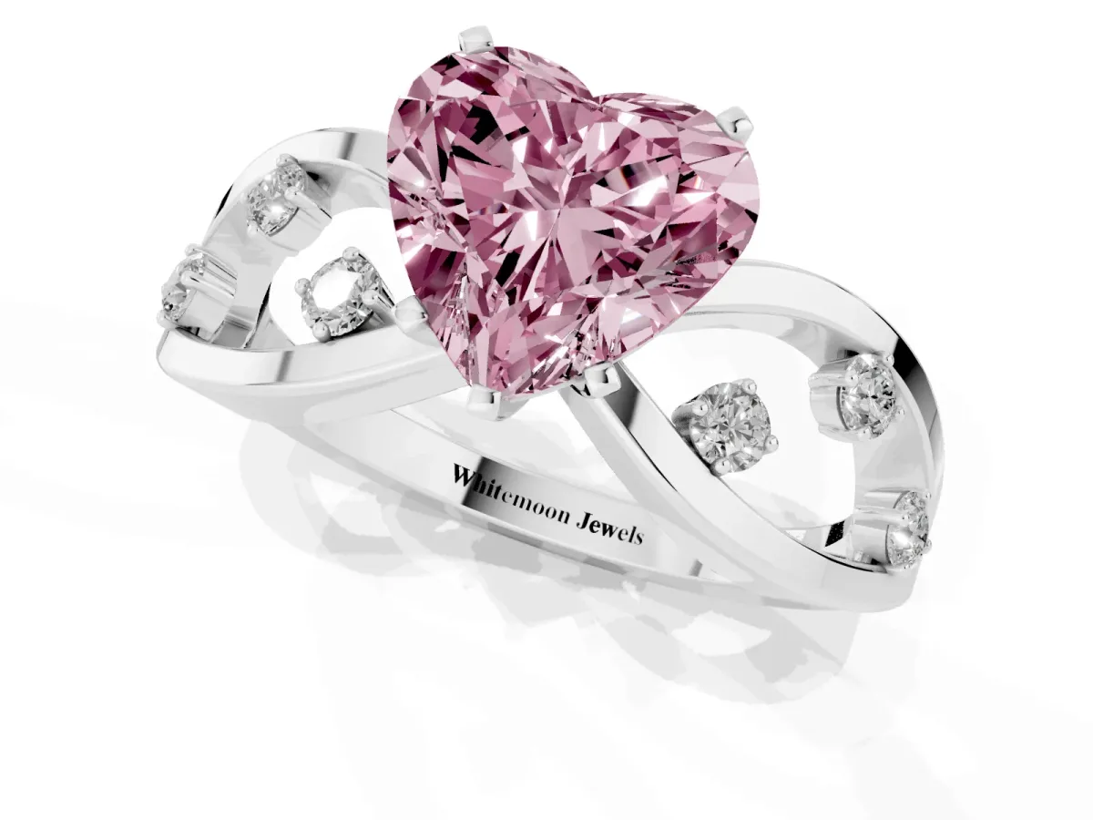 Fancy Pink Heart Cut Cut Solitaire Diamond with Side Stones on Criss-Cross Band and Four-Prong Setting Silver