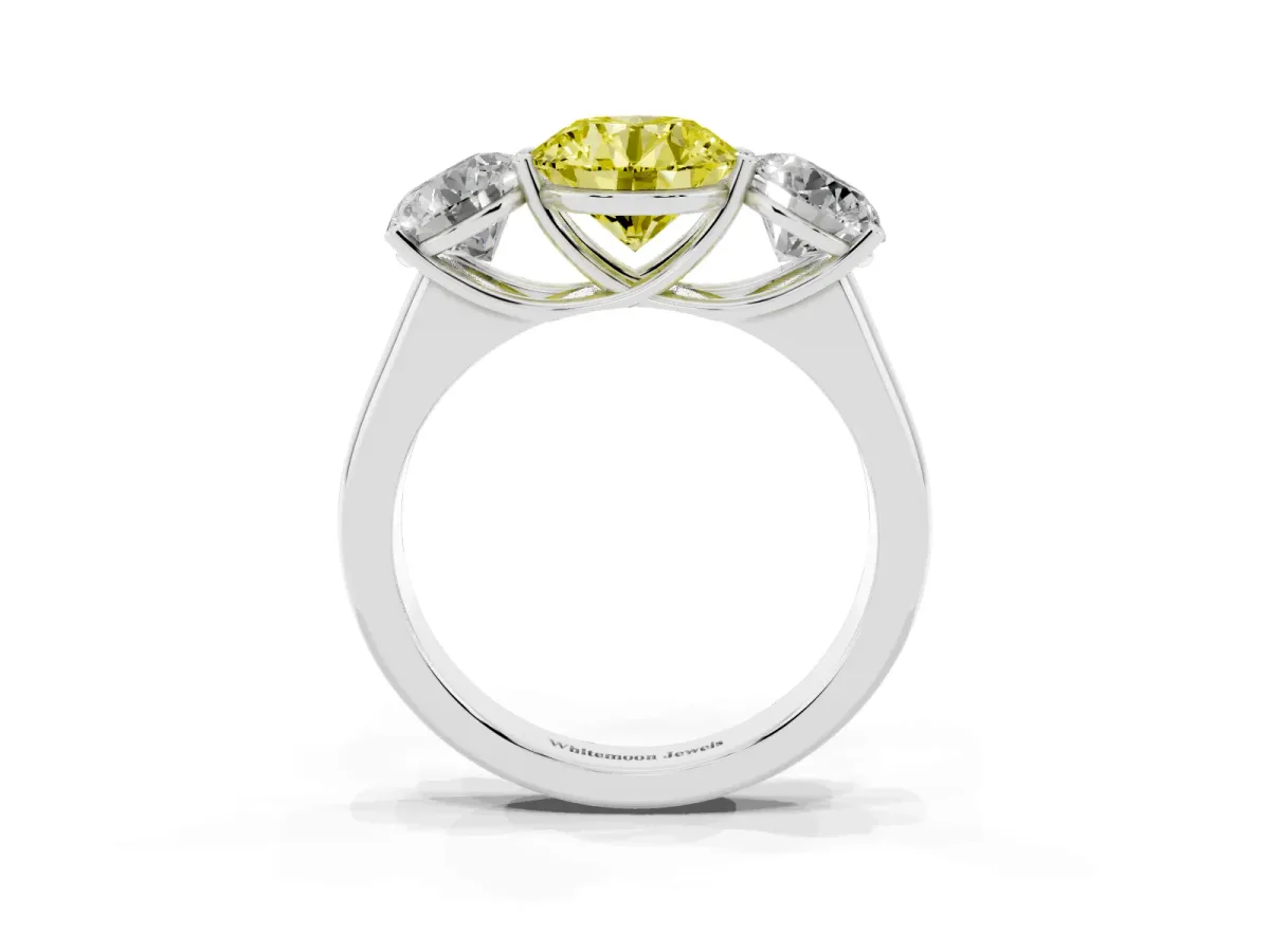 Fancy Yellow Round Cut Three-Stone Diamond Ring with Prong Setting on a Classic Band Silver