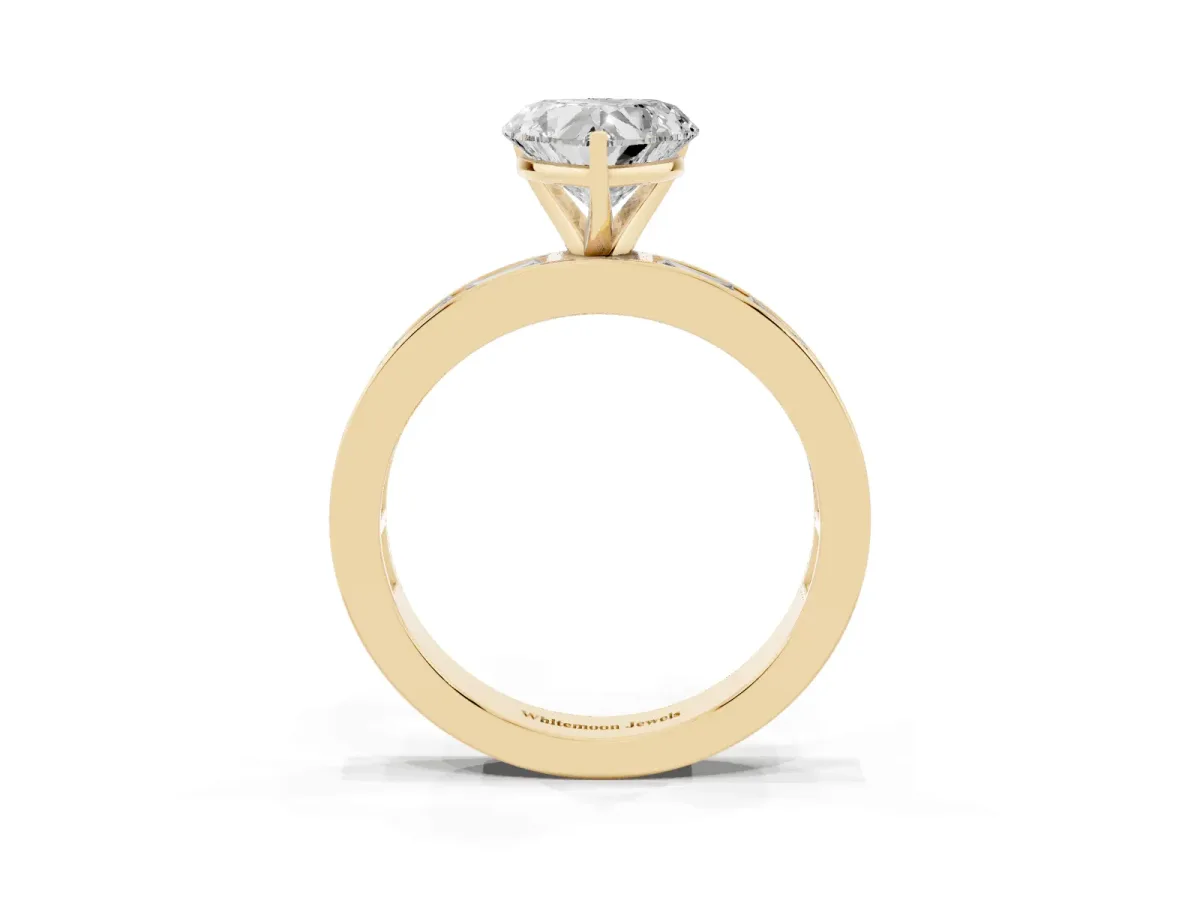 Heart Cut Solitaire Diamond Ring with Channel-Set Baguette Band and Four-Prong Setting Yellow gold