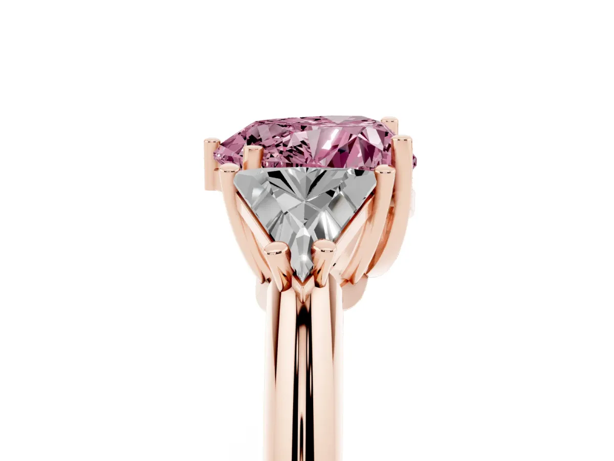 Fancy Pink Three-Stone Heart Cut Diamond Engagement Ring with Trillion Side Stones and Prong Setting Rose gold