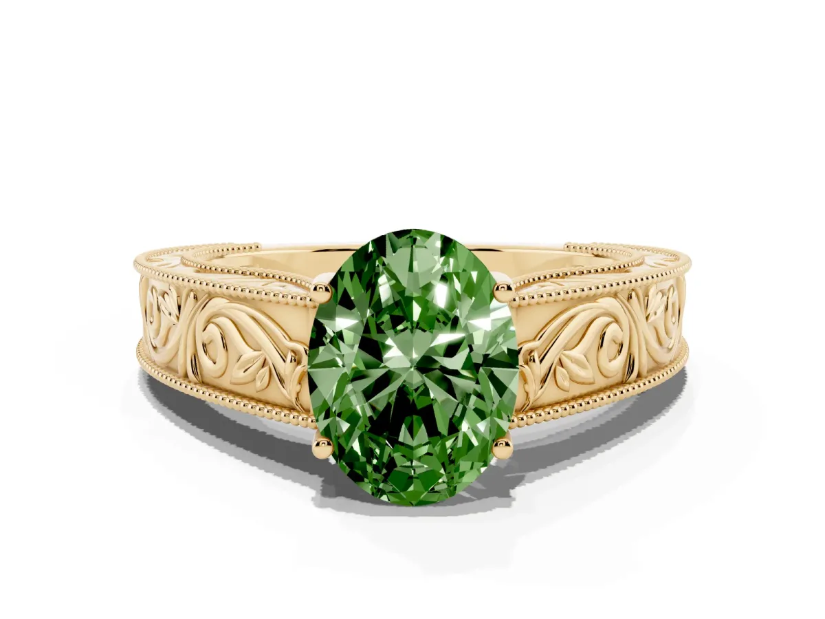 Fancy Green Oval Cut Diamond Solitaire Ring with Engraved Band and Four-Prong Setting Yellow gold
