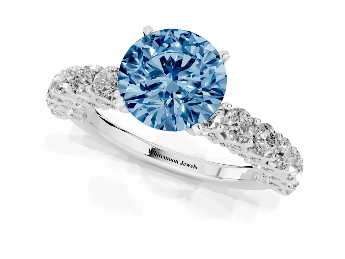 Fancy Blue Round Cut Diamond Solitaire Ring with Shared Prong Pavé Band and Four-Prong Setting Silver