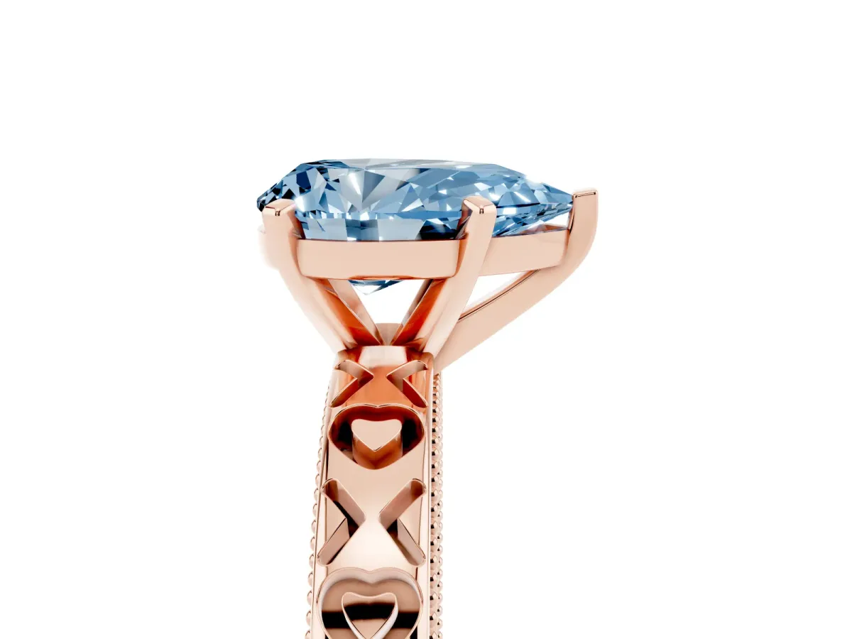 Fancy Blue Pear Cut Solitaire Diamond Engagement Ring with XO Engraved Band and Four-Prong Setting Rose gold