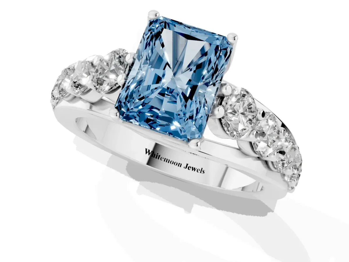 Fancy Blue Radiant Cut Diamond Engagement Ring with Pavé Band and Four-Prong Setting Silver