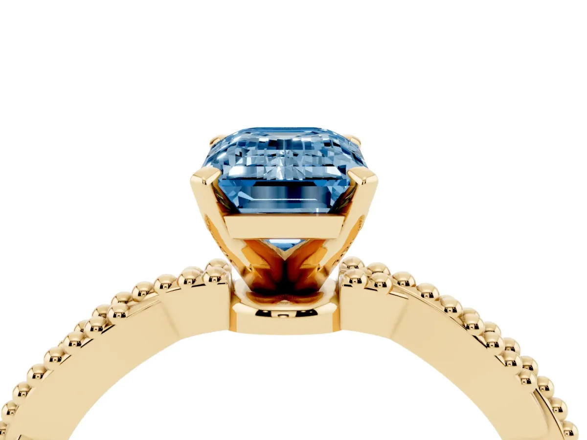 Fancy Blue Emerald Cut Solitaire Twisted Band with Bead Prong Setting Yellow gold