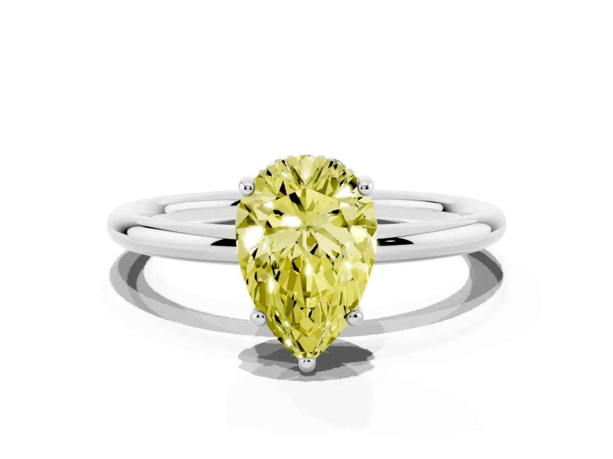 Fancy Yellow Pear Cut Solitaire Diamond Ring with a Classic Band and Four-Prong Setting Silver