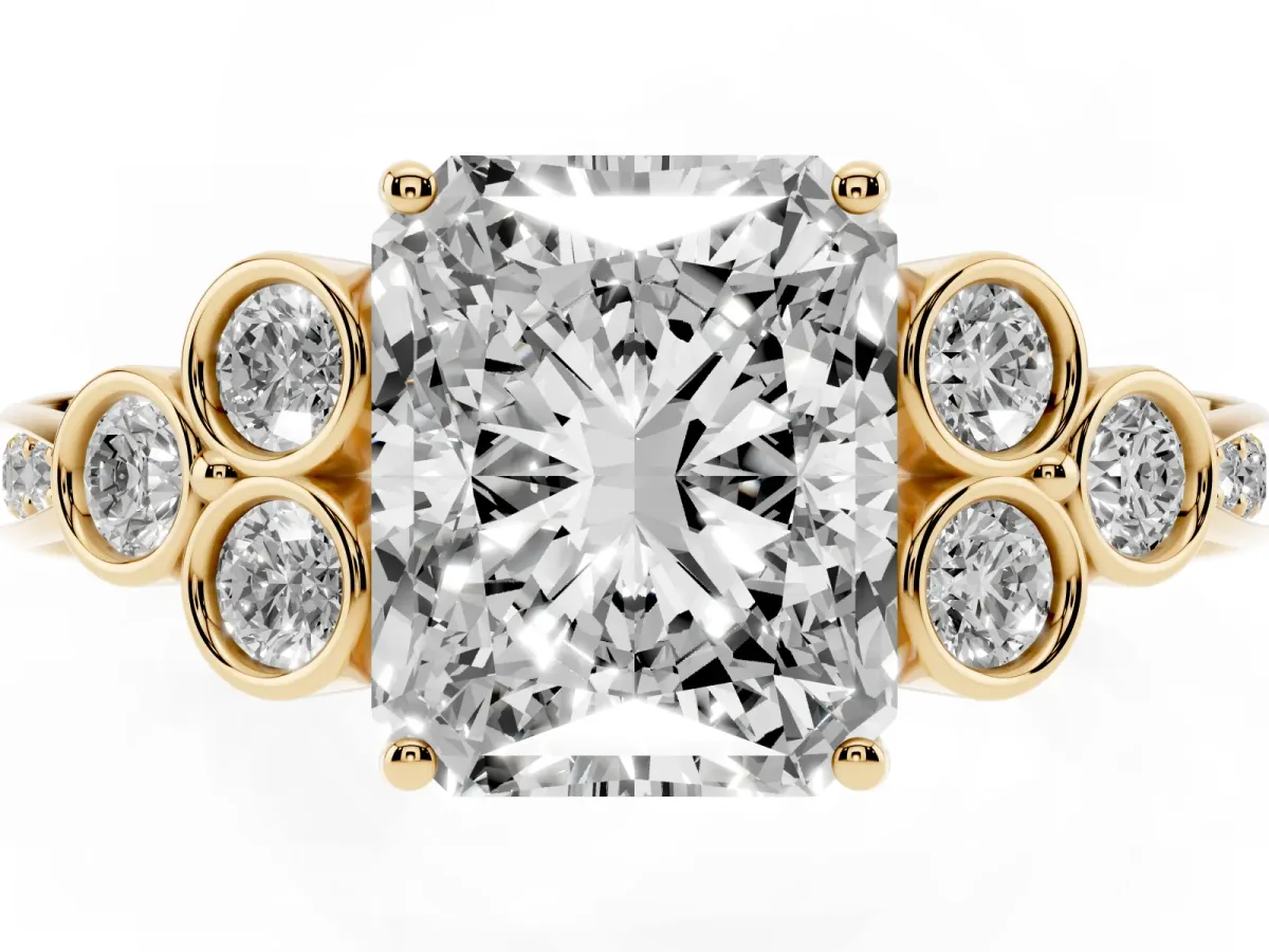 Radiant Cut Cut Diamond Engagement Ring with Bezel Set Round Side Stones and Prong Setting Yellow gold