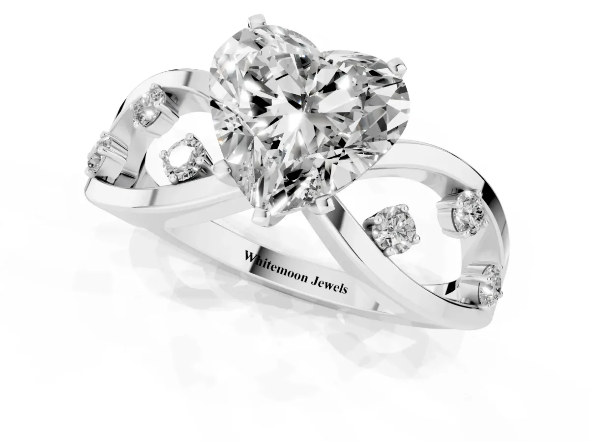 Heart Cut Cut Solitaire Diamond with Side Stones on Criss-Cross Band and Four-Prong Setting Silver