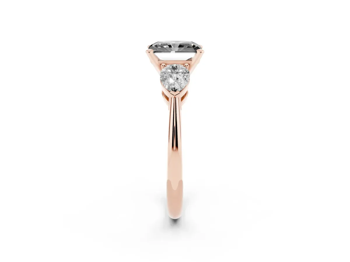 Fancy Black Three-Stone Radiant Cut Diamond Ring with Pear Side Stones and Four-Prong Setting Rose gold