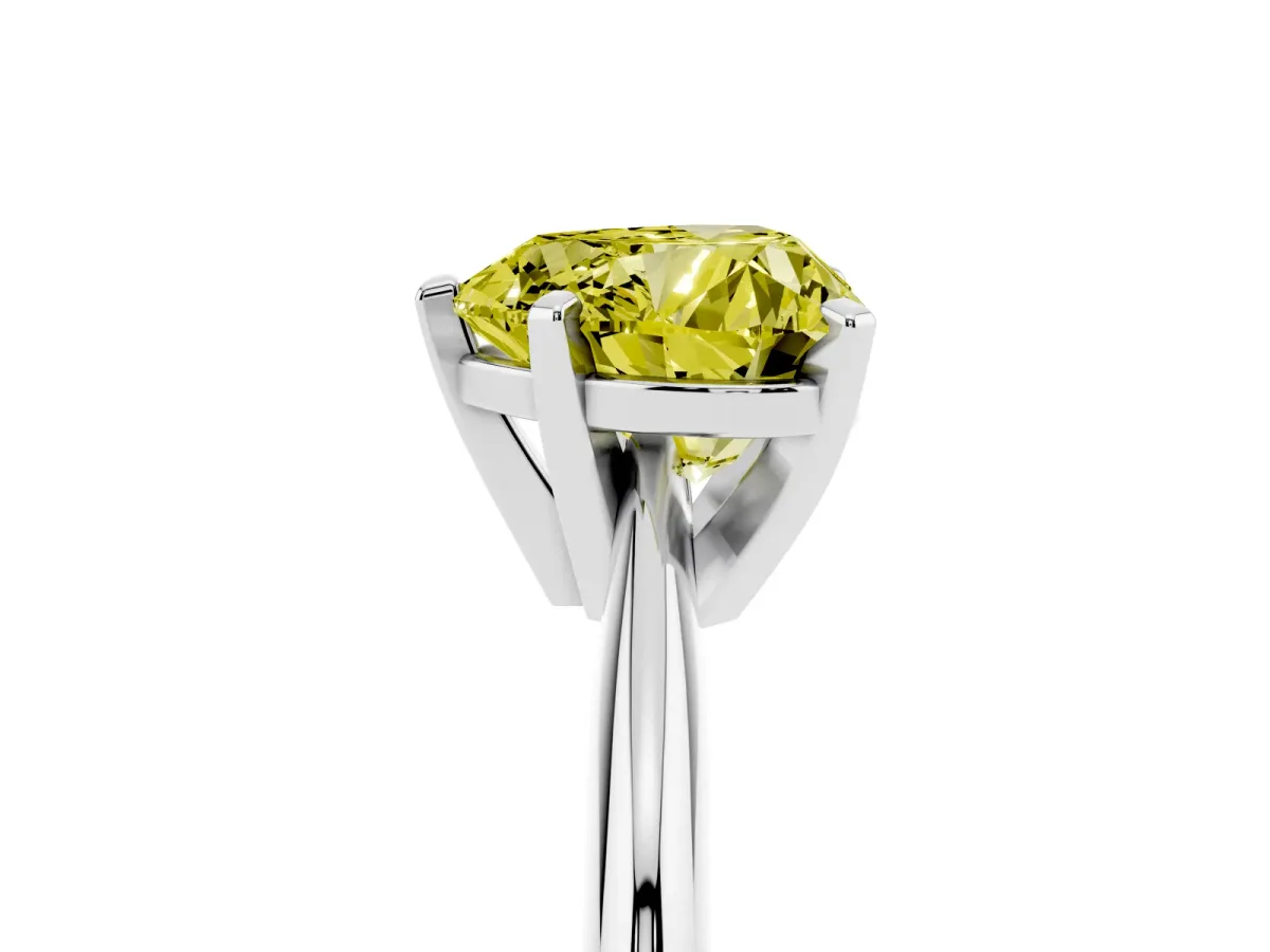 Fancy Yellow Heart Cut Cut Solitaire Ring with Four-Prong Setting on a Classic Band Silver
