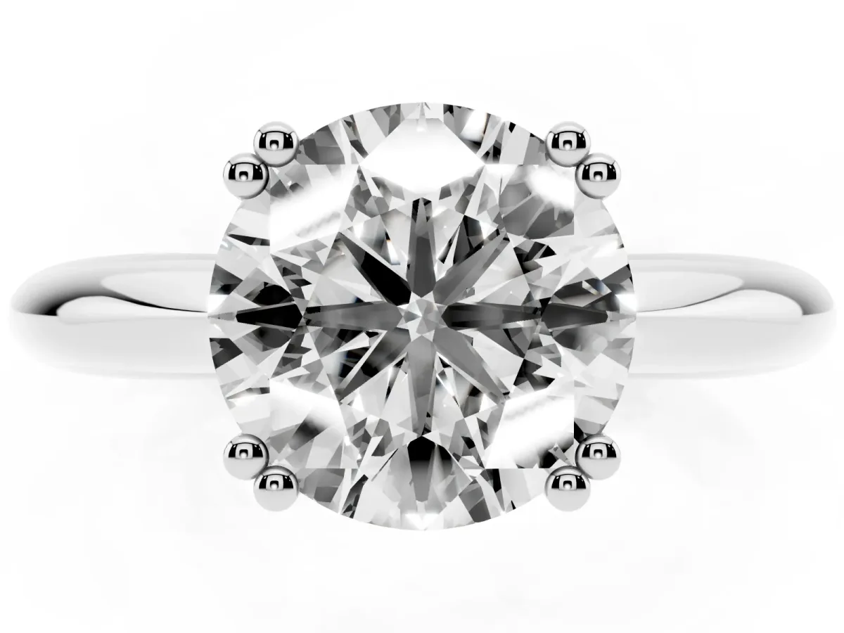 Round Cut Cut Solitaire Engagement Ring with Tapered Band and Four-Prong Setting Platinum