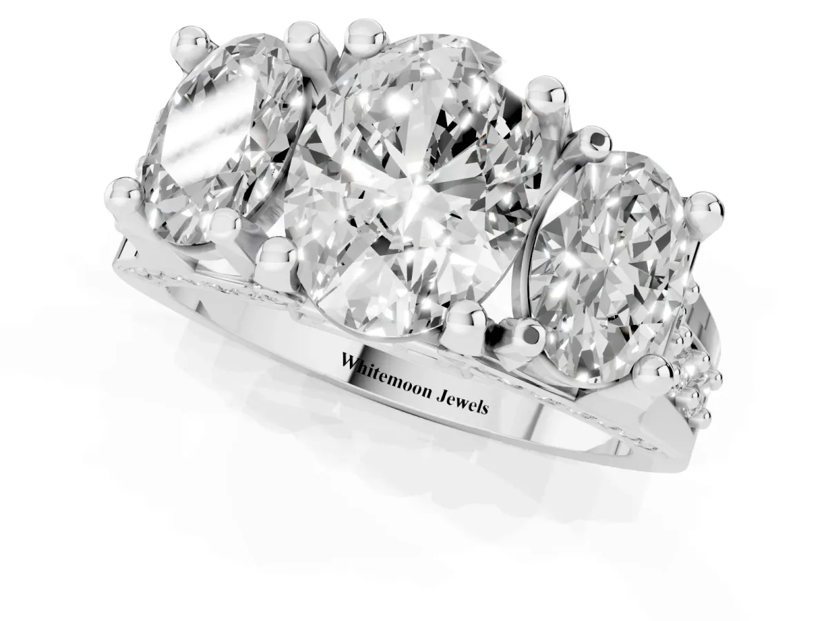 Oval Cut Diamond Three-Stone Ring with Channel Set Band and Four-Prong Setting Silver