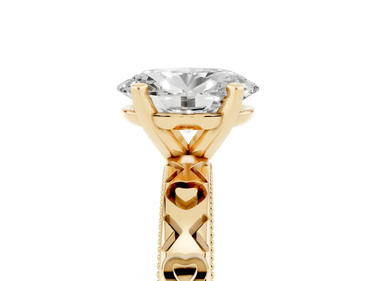 Oval Cut Solitaire Diamond Engagement Ring with XO Engraved Band and Four-Prong Setting Yellow gold