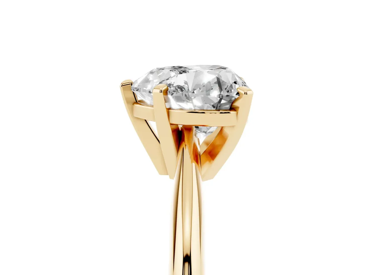 Heart Cut Cut Solitaire Ring with Four-Prong Setting on a Classic Band Yellow gold