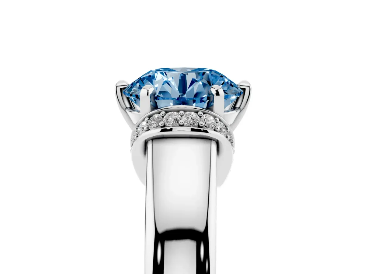 Fancy Blue Round Cut Solitaire Diamond Ring with Pave Band and Six-Prong Setting Silver