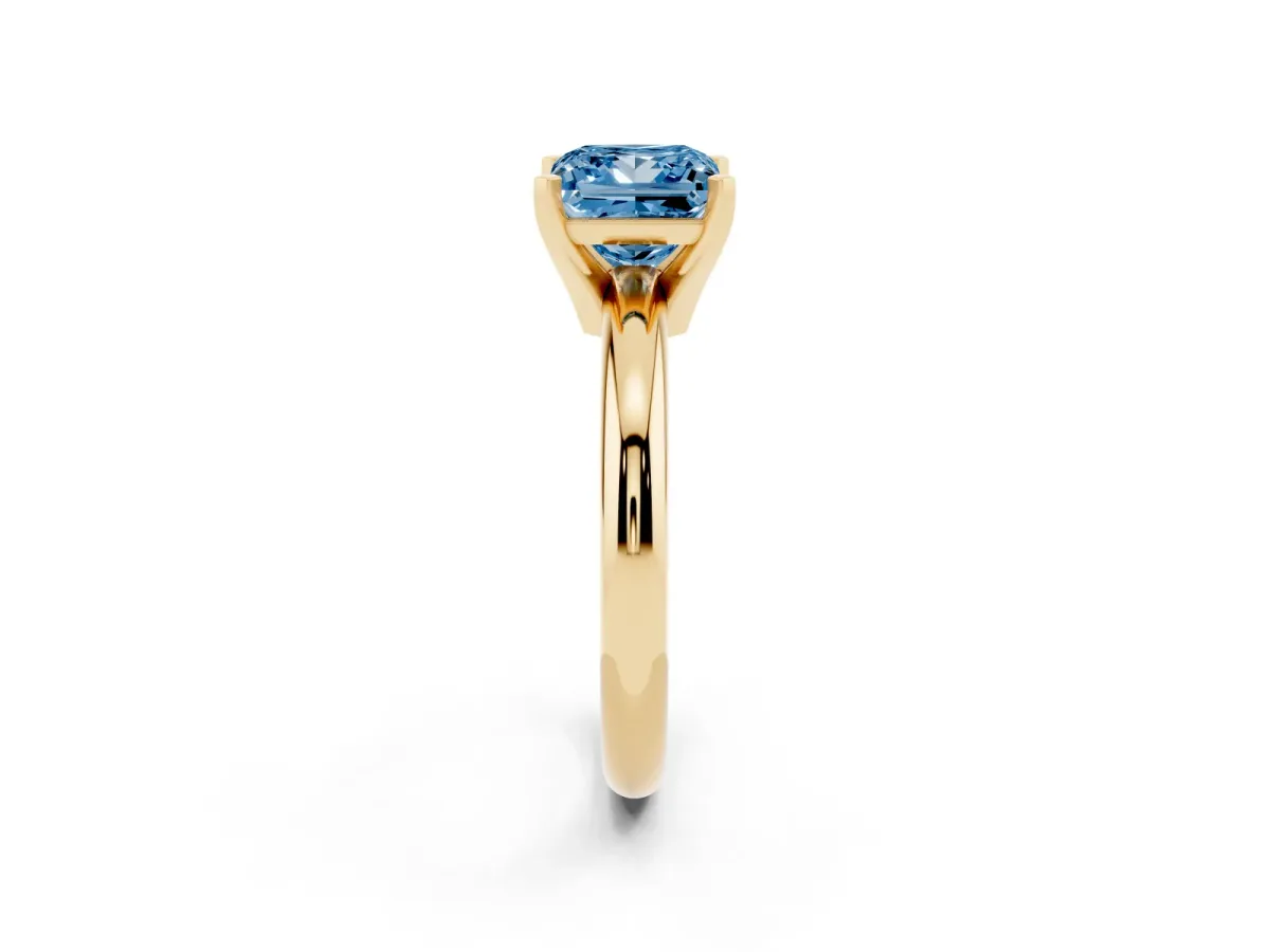 Fancy Blue Princess Cut Diamond Solitaire Engagement Ring with Round Band and Four-Prong Setting Yellow gold