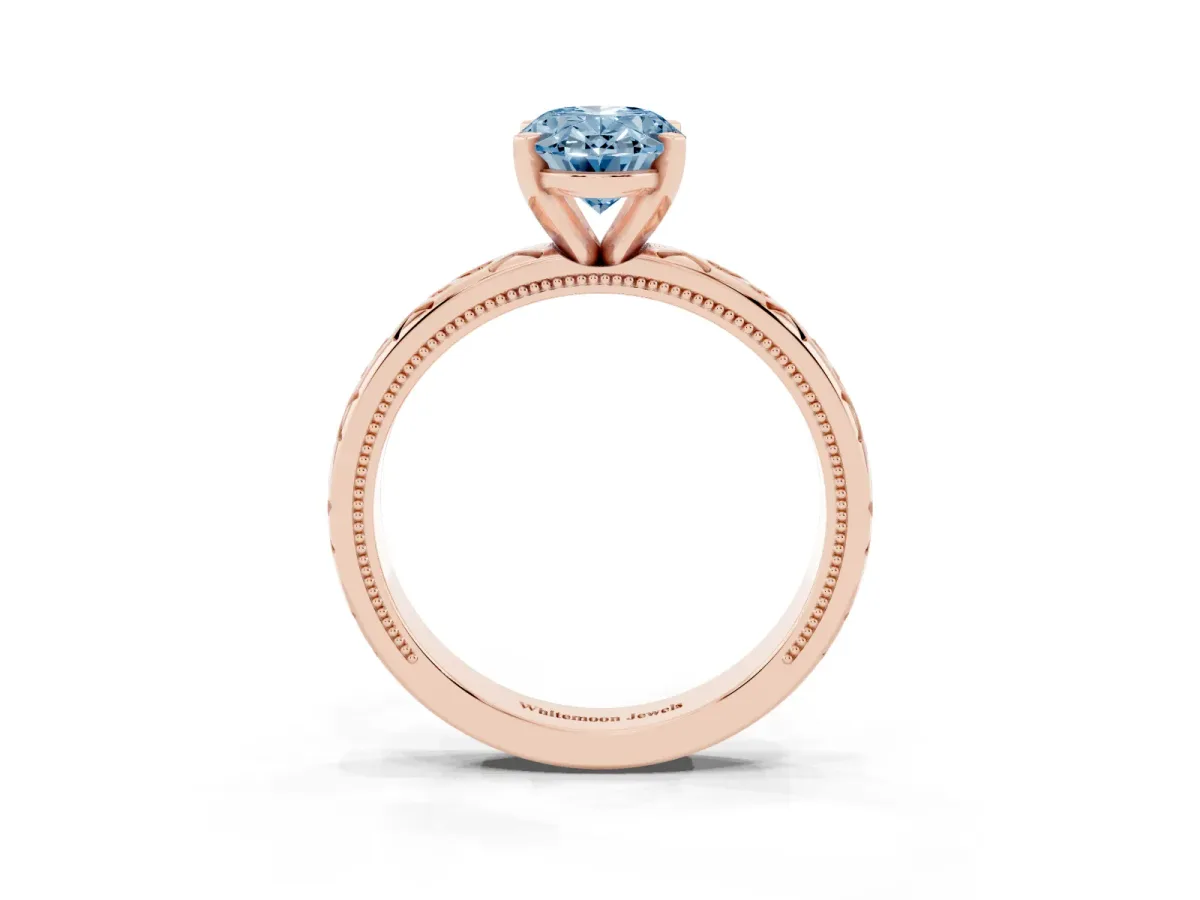 Fancy Blue Oval Cut Solitaire Engagement Ring with Scrollwork Band and Four-Prong Setting Rose gold