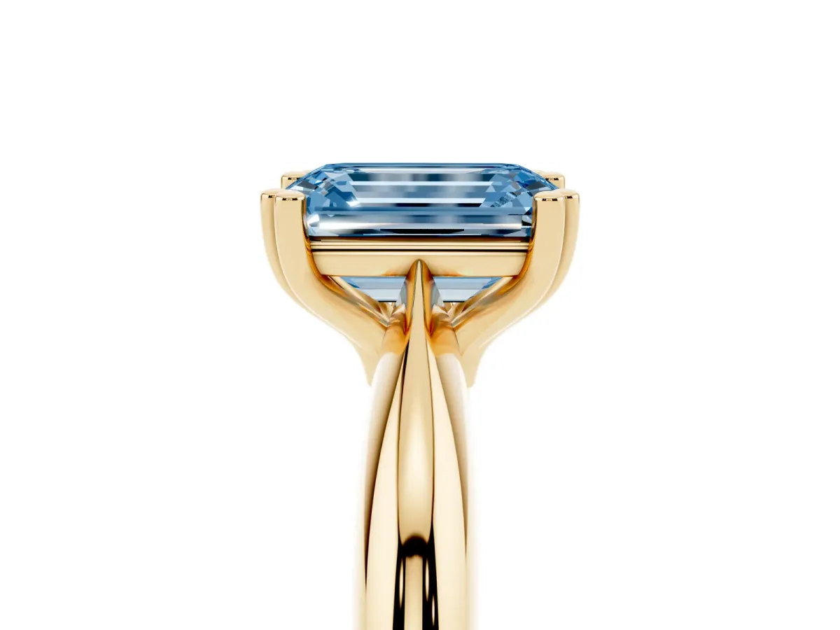 Fancy Blue Emerald Cut Cut Solitaire Engagement Ring with Tapered Band and Four-Prong Setting Yellow gold
