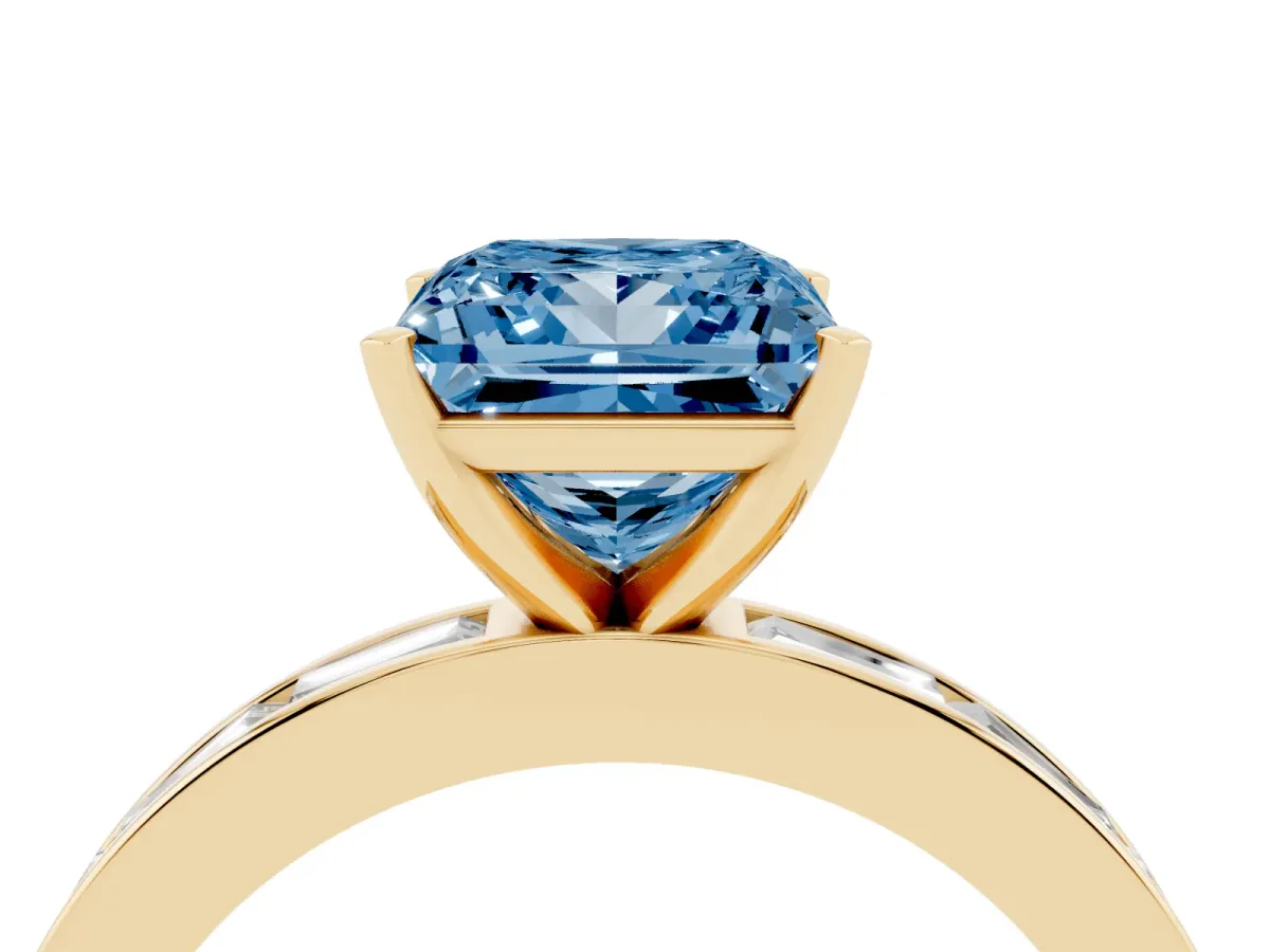 Fancy Blue Princess Cut Solitaire Diamond Ring with Channel-Set Baguette Band and Four-Prong Setting Yellow gold