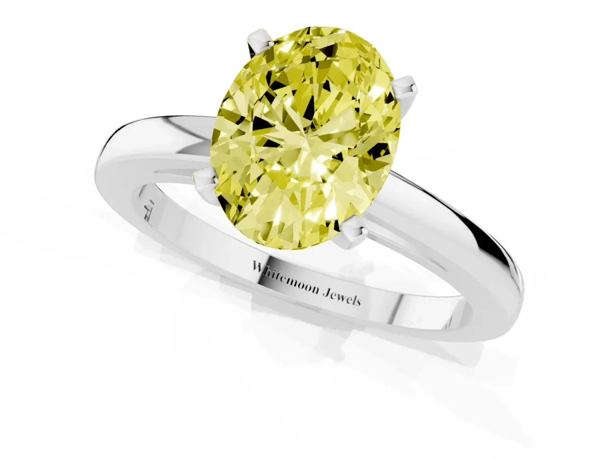 Fancy Yellow Oval Cut Solitaire Diamond Engagement Ring with Four-Prong Setting on a Classic Band Silver