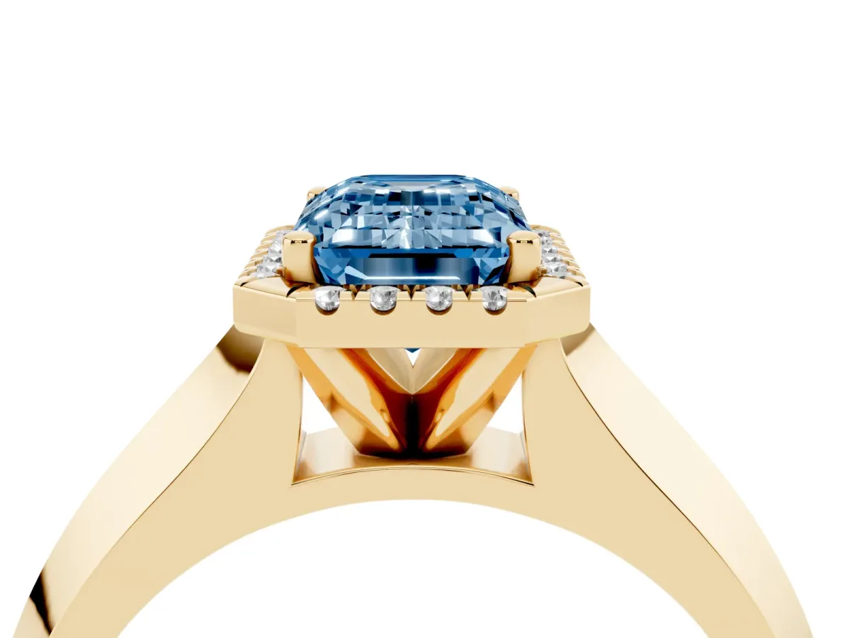 Fancy Blue Emerald Cut Halo Diamond Ring with Cathedral Band and Four-Prong Setting Yellow gold