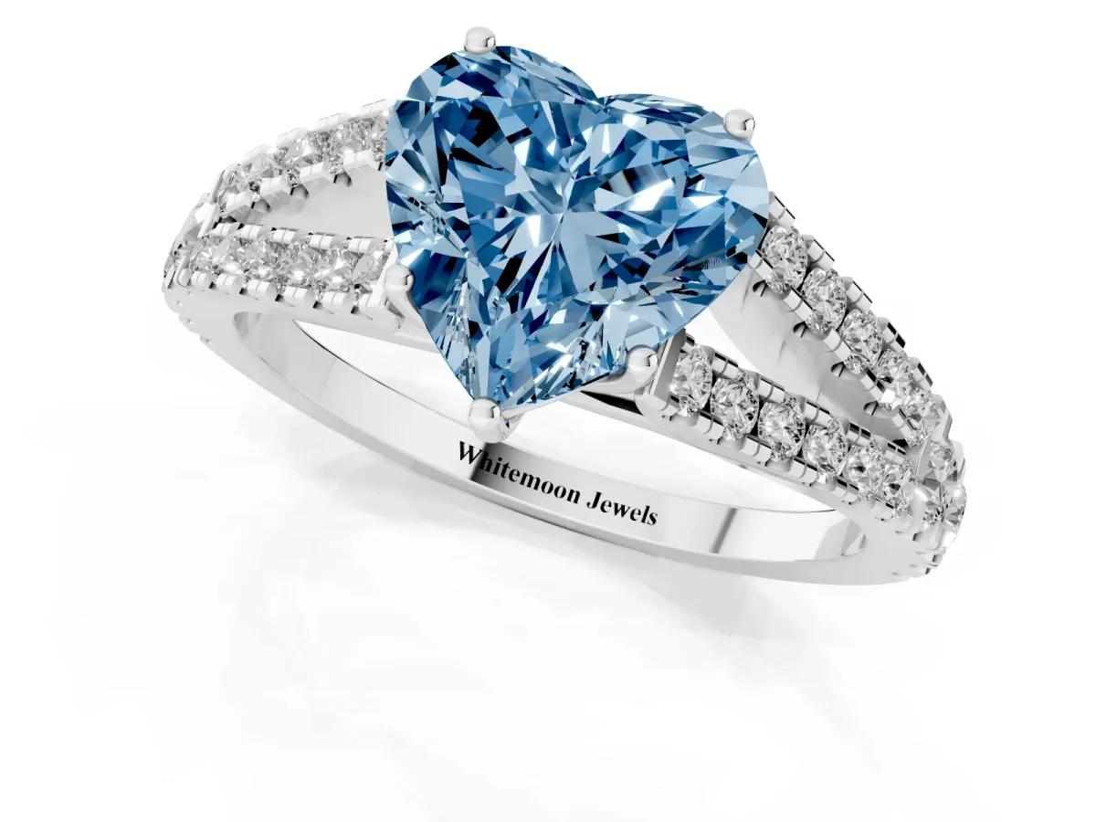 Fancy Blue Heart Cut Diamond Split Shank Engagement Ring with Round Pavé and Prong Setting Platinum