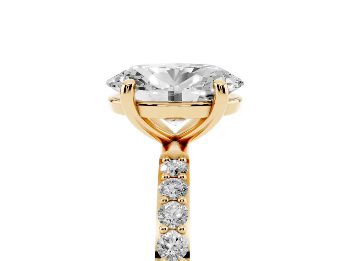 Oval Cut Diamond Solitaire Ring with Round Pavé Band and Prong Setting Yellow gold