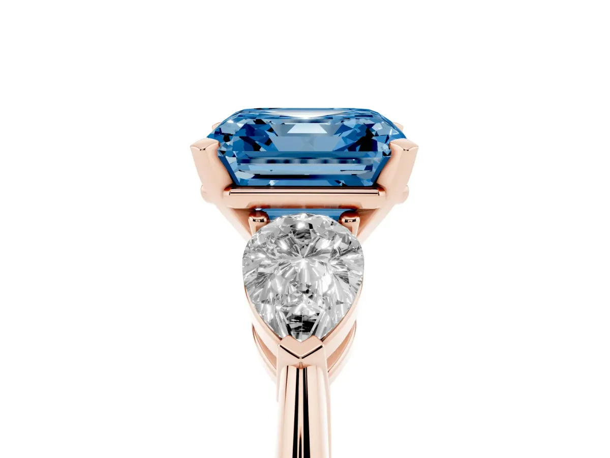 Fancy Blue Three-Stone Asscher Cut Diamond Ring with Pear Side Stones and Four-Prong Setting Rose gold