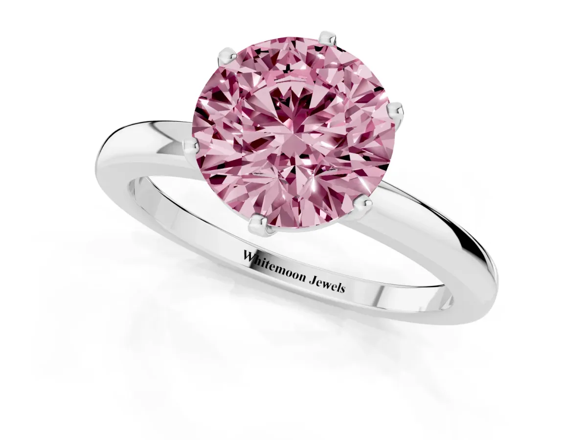 Fancy Pink Round Cut Solitaire Diamond Ring with Six-Prong Setting on a Classic Band Platinum