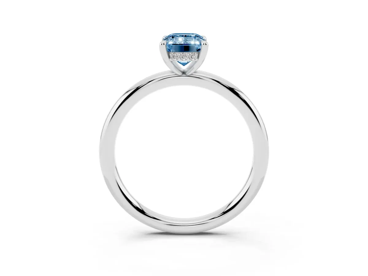 Fancy Blue Emerald Cut Diamond Solitaire Ring with Thin Band and Four-Prong Setting Silver