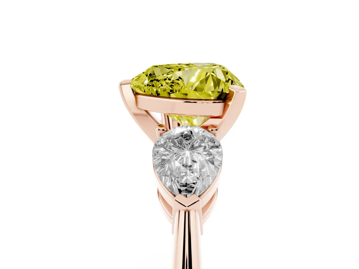 Fancy Yellow Three-Stone Heart Cut Diamond Ring with Pear Side Stones and Four-Prong Setting Rose gold