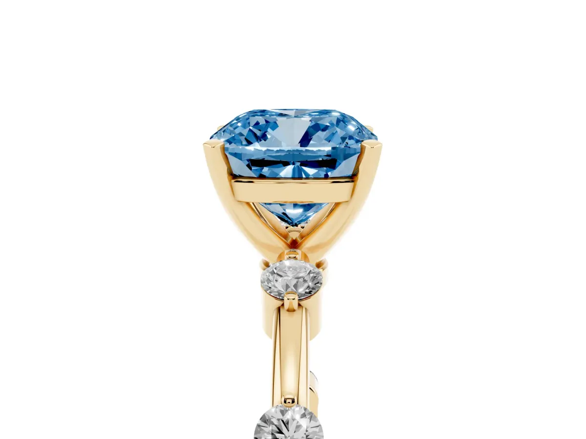 Fancy Blue Cushion Cut Solitaire Diamond Ring with Bezel Set Side Stones and Prong Setting Yellow gold