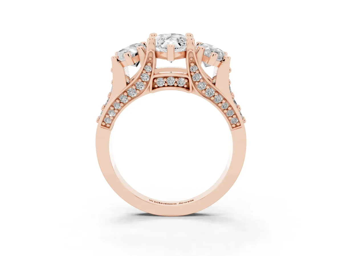 Marquise Cut Diamond Three-Stone Ring with Channel Set Band and Four-Prong Setting Rose gold