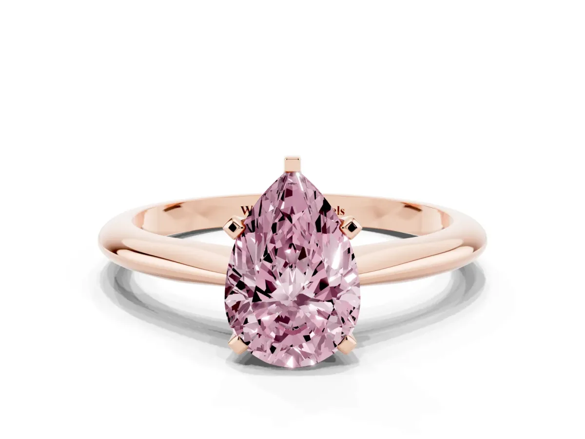 Fancy Pink Pear Cut Cut Solitaire Ring with Four-Prong Setting on a Classic Band Rose gold