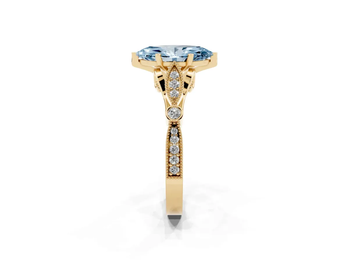 Fancy Blue Marquise Cut Cut Diamond with Milgrain Marquise and Bezel Accents on a Solitaire Band with Prong Setting Yellow gold