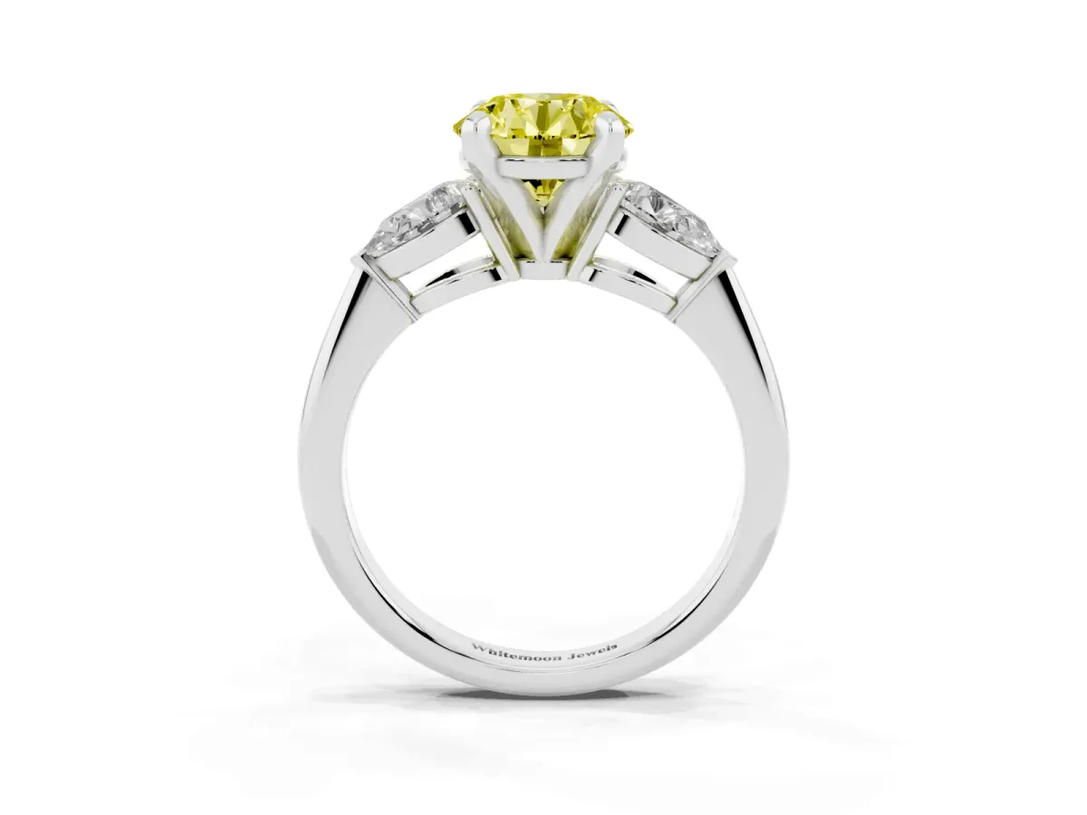 Fancy Yellow Three-Stone Round Cut Diamond Ring with Pear Side Stones and Four-Prong Setting Platinum