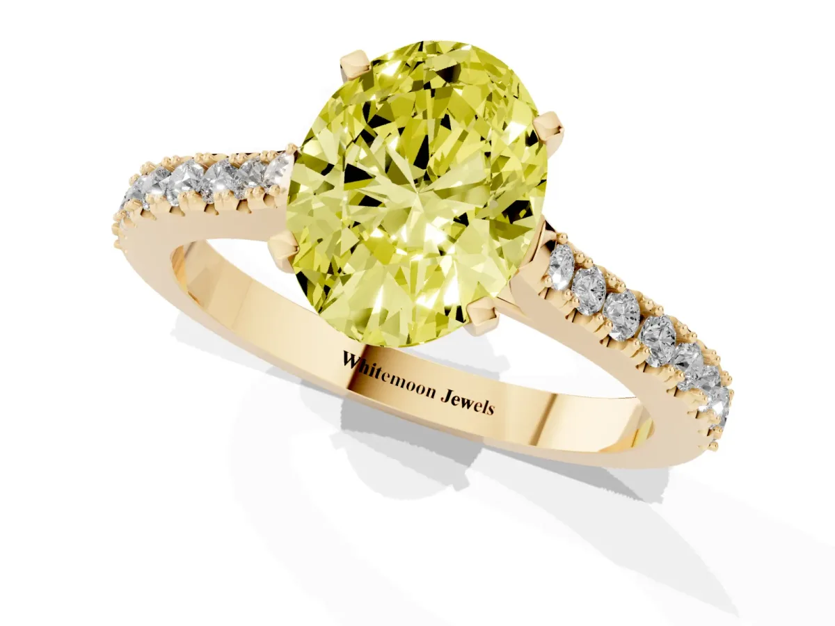 Fancy Yellow Oval Cut Cut Solitaire Diamond Engagement Ring with Pave Band and Four-Prong Setting Yellow gold