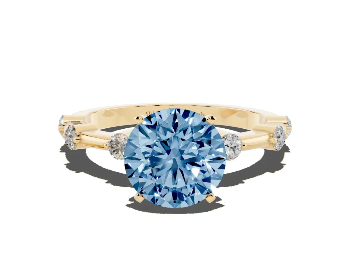 Fancy Blue Round Cut Solitaire Diamond Ring with Bezel Set Side Stones and Prong Setting Yellow gold
