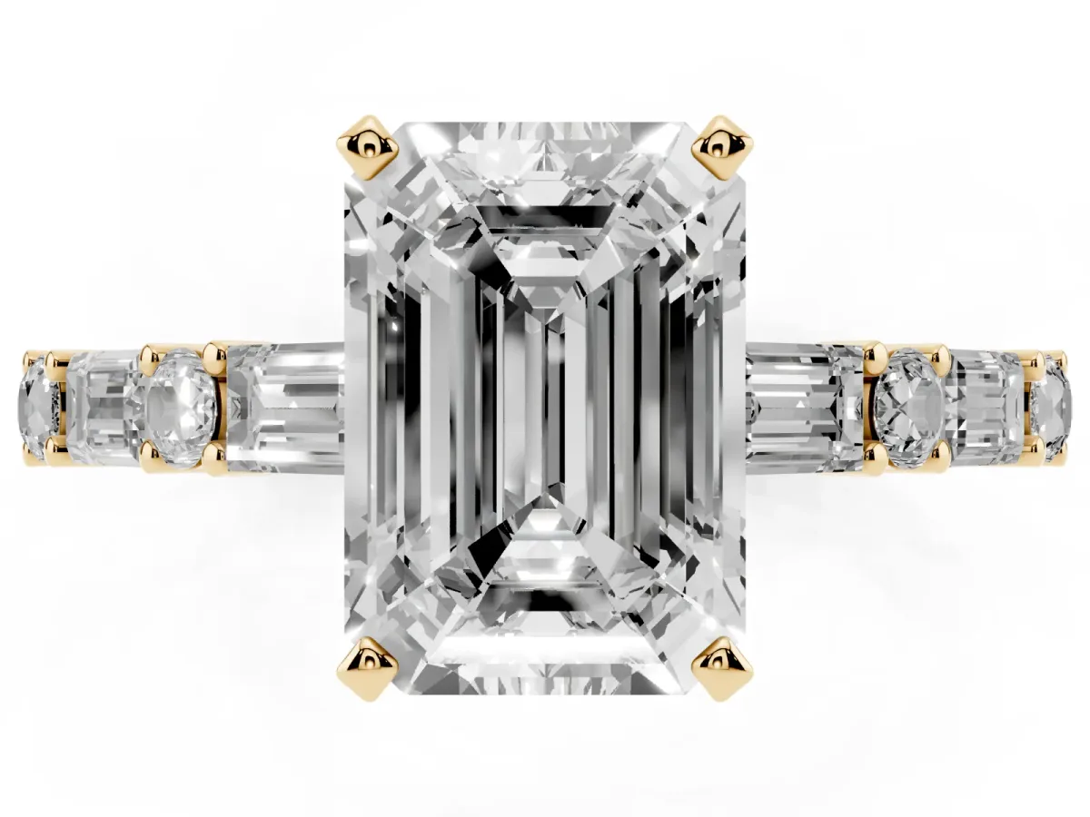 Emerald Cut Diamond Solitaire with Side Baguettes and Channel Set Band Yellow gold