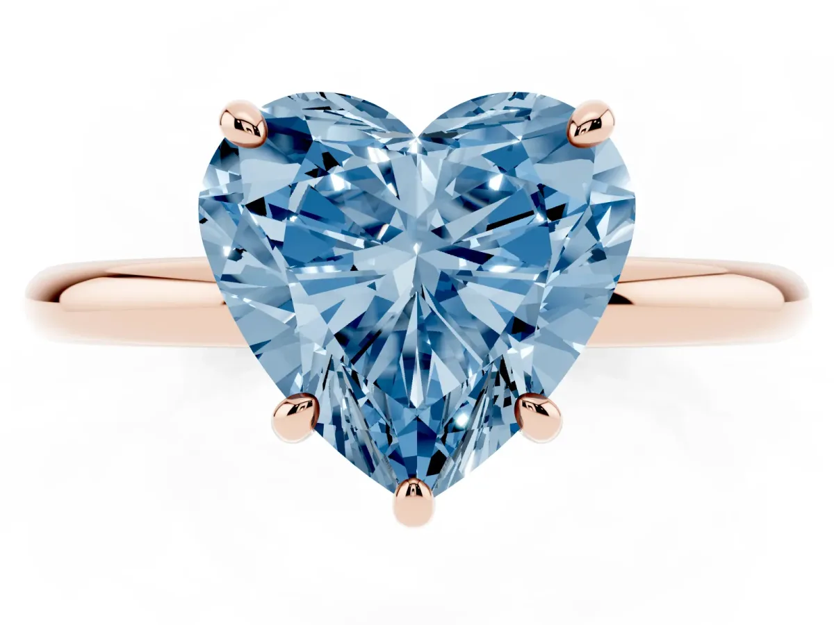 Fancy Blue Heart Cut Solitaire Diamond Ring with Four-Prong Setting on a Plain Band Rose gold