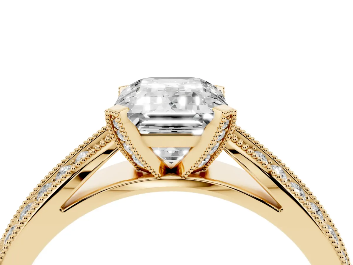 Emerald Cut Diamond Solitaire Ring with Milgrain Round Pavé Band and Prong Setting Yellow gold