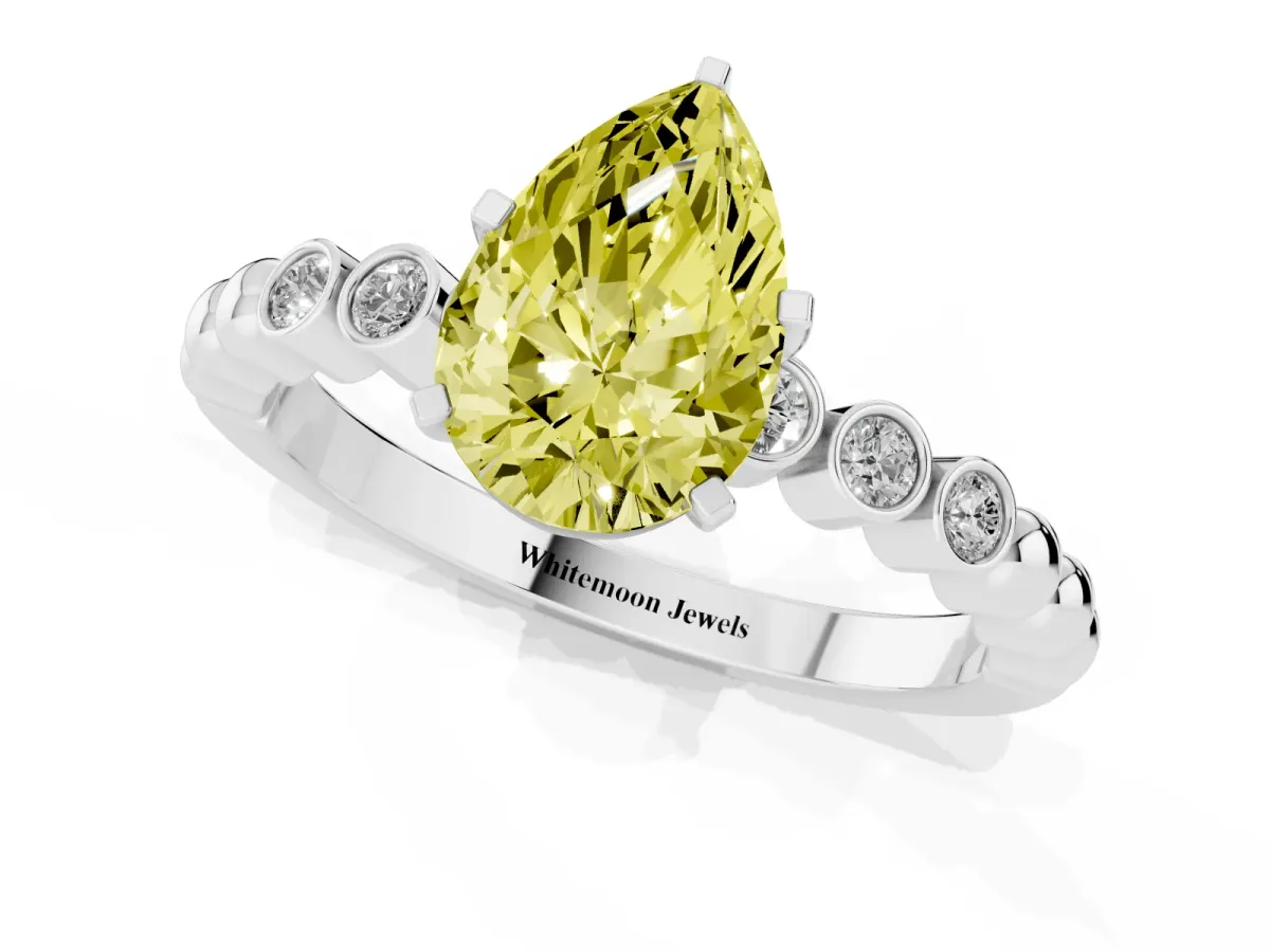 Fancy Yellow Pear Cut Solitaire Bezel Accent Diamond Engagement Ring with Beaded Band and Four-Prong Setting Platinum