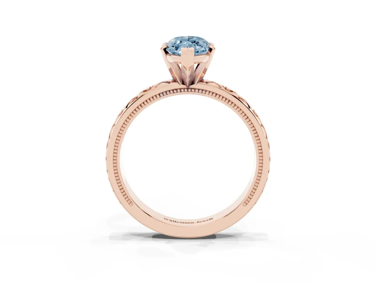 Fancy Blue Marquise Cut Solitaire Diamond Engagement Ring with XO Engraved Band and Four-Prong Setting Rose gold