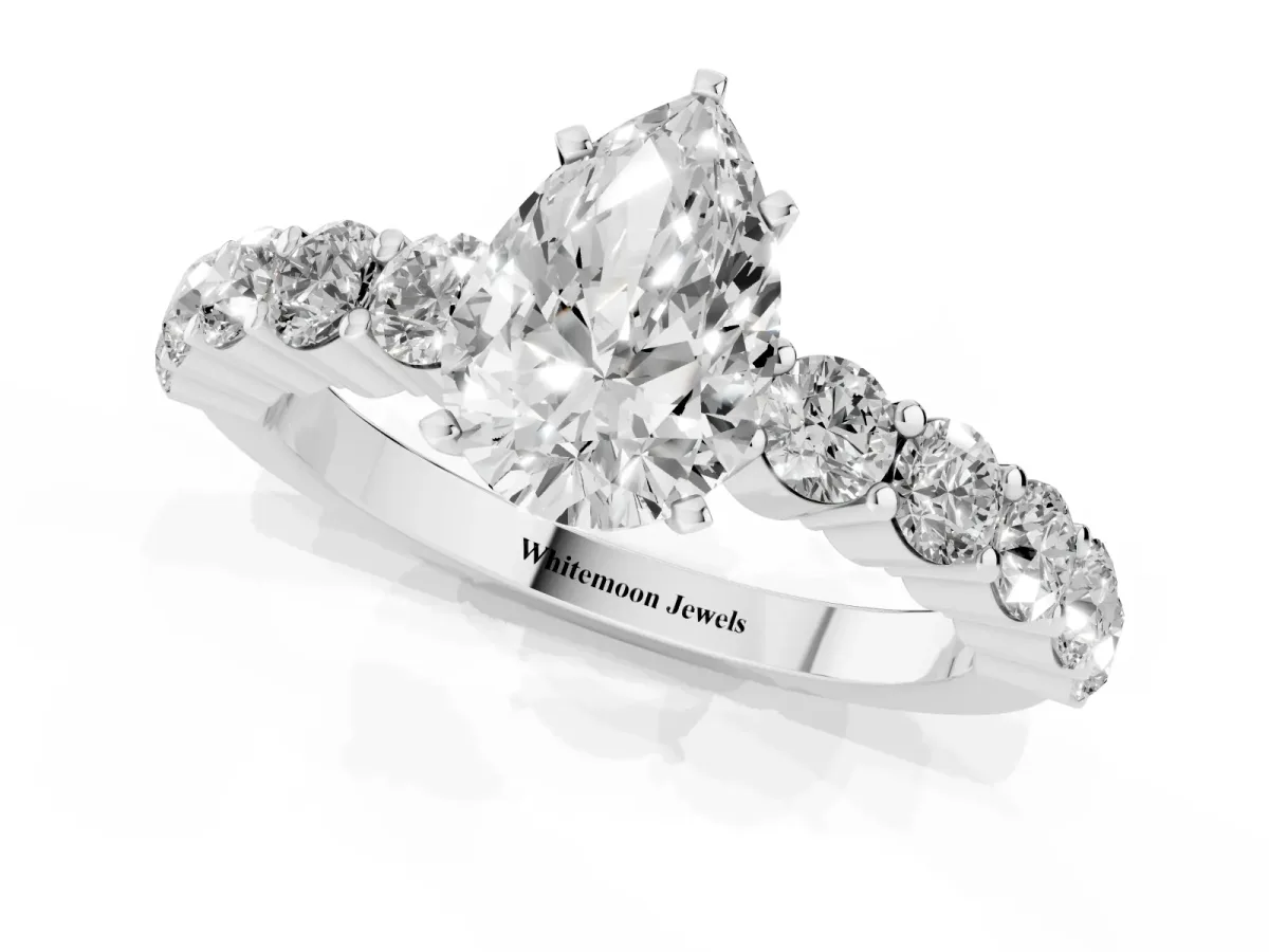 Pear Cut Diamond Solitaire Ring with Shared Prong Round Side Stones White gold