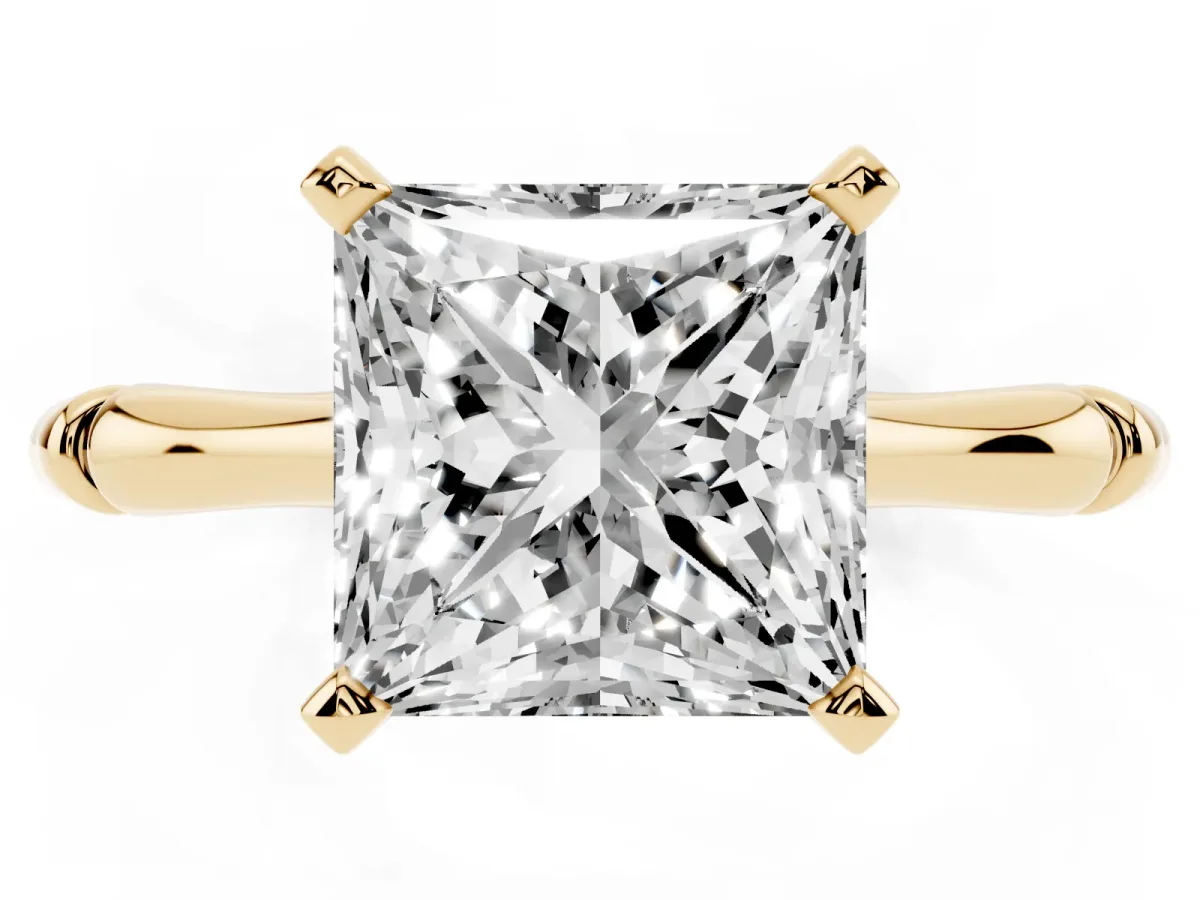 Princess Cut Solitaire Diamond Ring with Bamboo Band and Four-Prong Setting Yellow gold