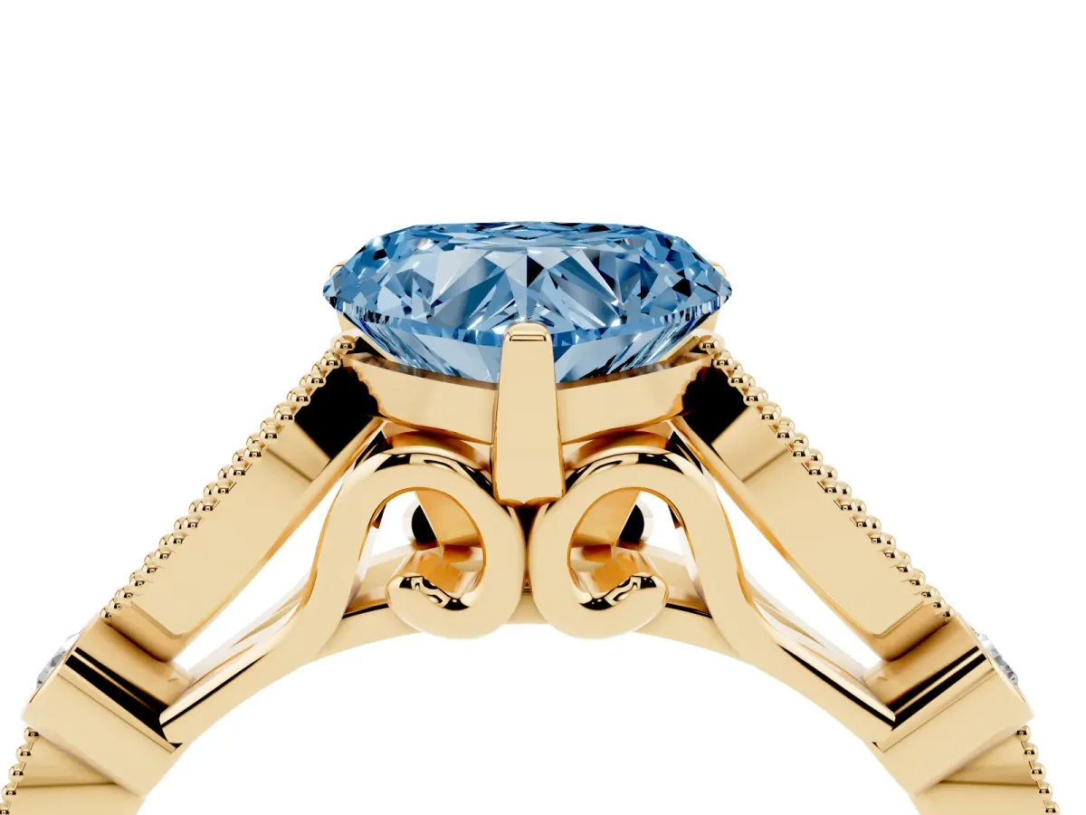 Fancy Blue Heart Cut Cut Diamond with Milgrain Marquise and Bezel Accents on a Solitaire Band with Prong Setting Yellow gold