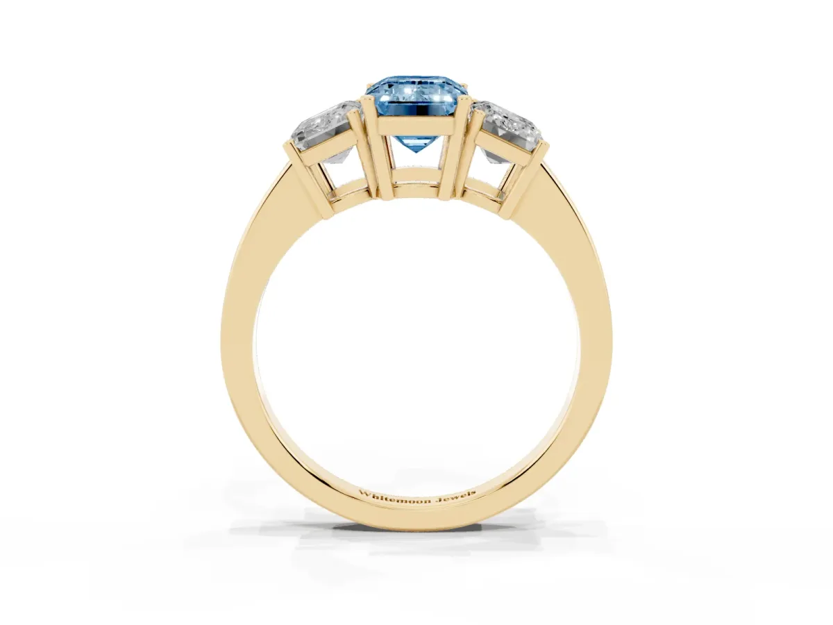 Fancy Blue Three-Stone Emerald Cut Cut Diamond Engagement Ring with Flat Band and Four-Prong Setting Yellow gold