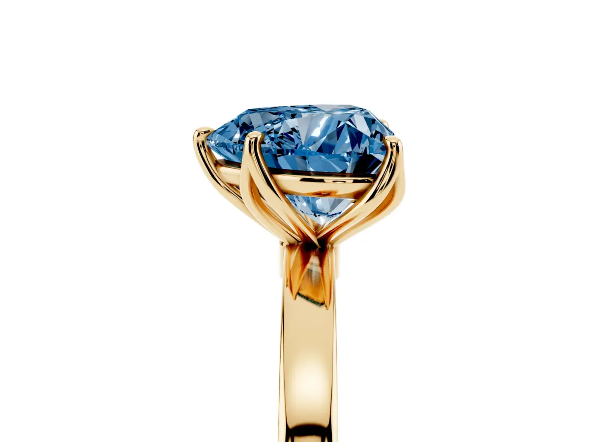 Fancy Blue Heart Cut Diamond Solitaire Ring with Thin Band and Prong Setting Yellow gold