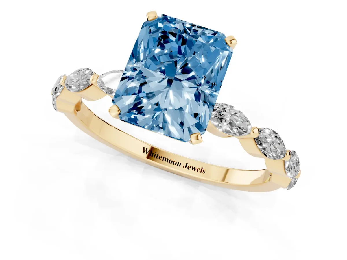Fancy Blue Radiant Cut Diamond Ring with Marquise Side Stones and Prong Setting Yellow gold
