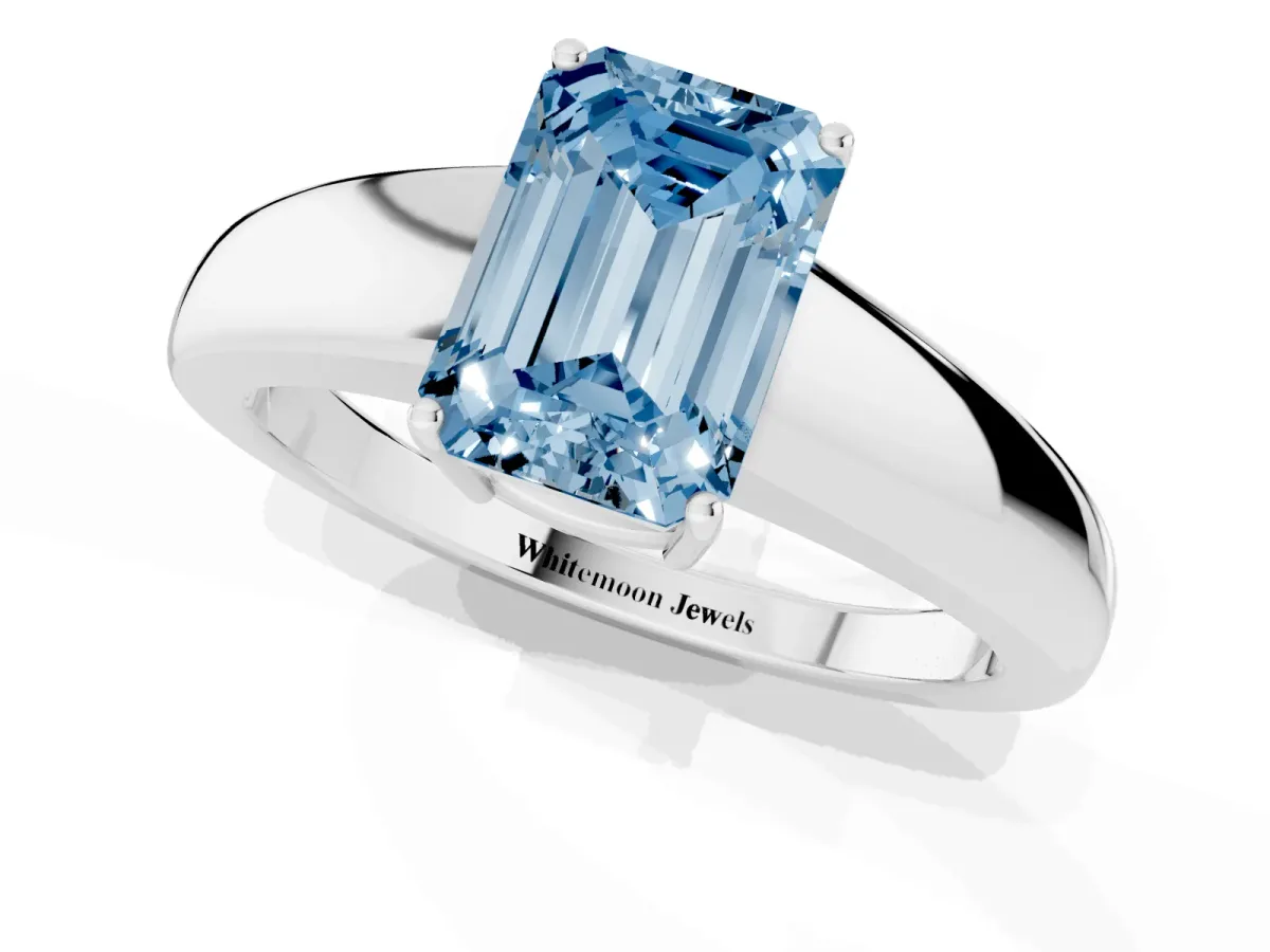 Fancy Blue Emerald Cut Solitaire Diamond Ring with Tapered Band and Four-Prong Setting Platinum